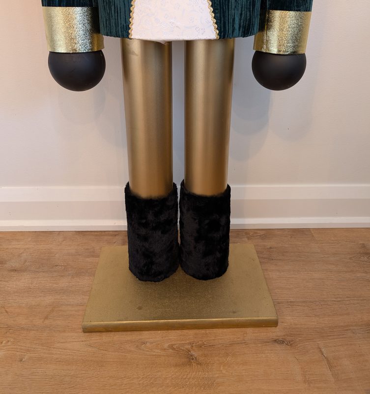 Gold legs, black faux-fur boots and the square gold base